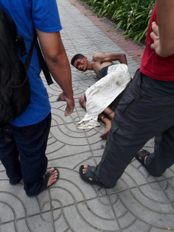 NAKED MAN RUNS ACROSS TOP OF CARS