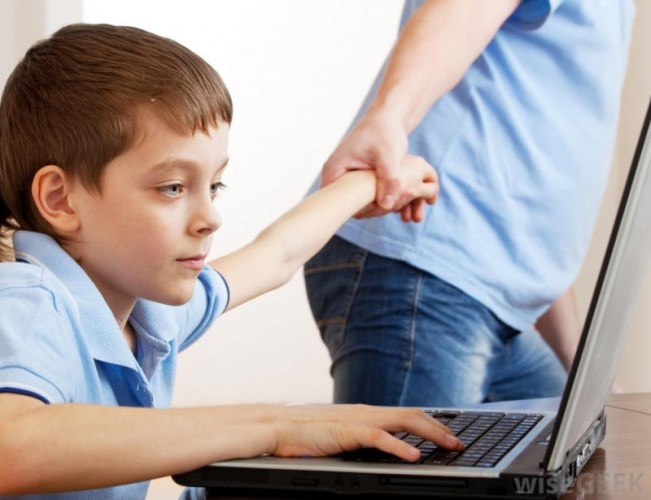 man-dragging-kid-off-computer